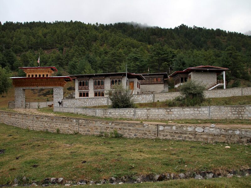 The buckwheat fields and forested slopes of the Bumthang valleys in central Bhutan